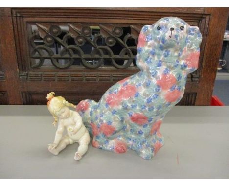A mixed lot to include a ceramic multi coloured dog and baby 