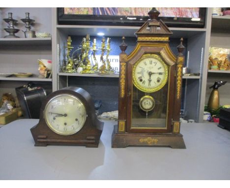 A 1930's oak cased mantle clock and a late 19th century stained pine case mantle clock 