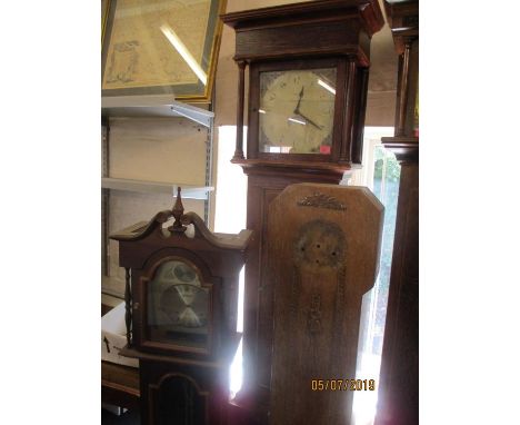 A 30 hour long case clock together with two granddaughter clock cases 