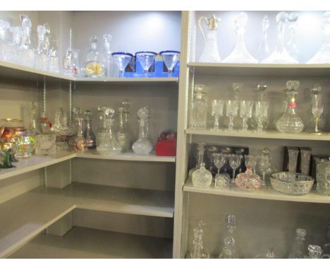 A large selection of glassware to include forty four decanters, hand blown glasses, wine glasses, baskets and other items 