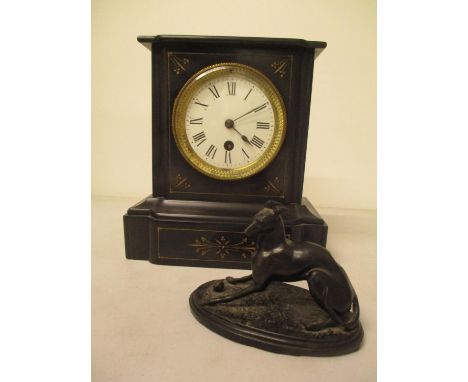 A Victorian black marble cased mantle clock and a soft metal model of a greyhound 