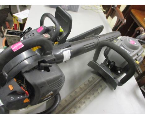 Petrol garden tools to include a Titan chain saw, a Titan hedge cutter, a McCulloch blower and a rotavator 