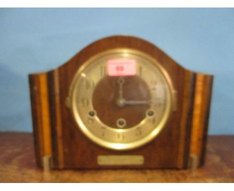 A 1930s walnut mantle clock 
