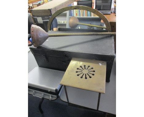 A mixed lot to include a leather bound trunk, an Arts and Crafts brass mirror and other items 
