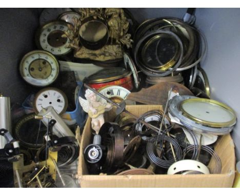 A large selection of clock parts to include dials, cases, movements and other items 