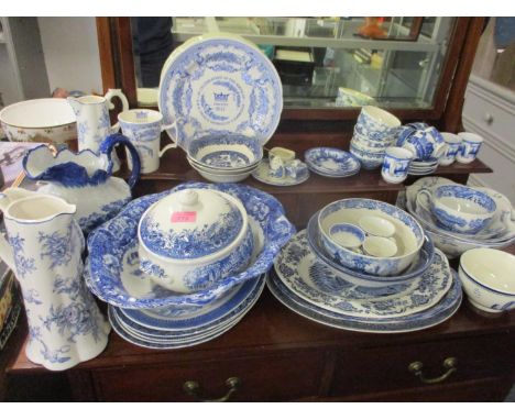 A quantity of blue and white china tableware to include Enoch Wedgwood Avon Cottage bowls, Churchill fruit bowls and Spode 