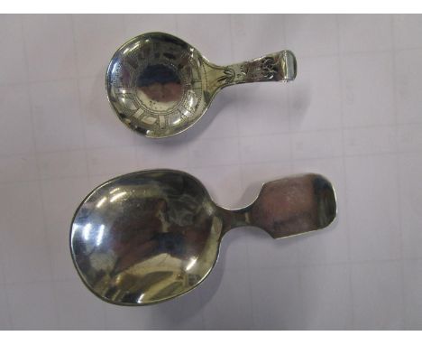 A small Georgian silver tea caddy spoon with engraved decoration and a 20th century silver tea caddy spoon 