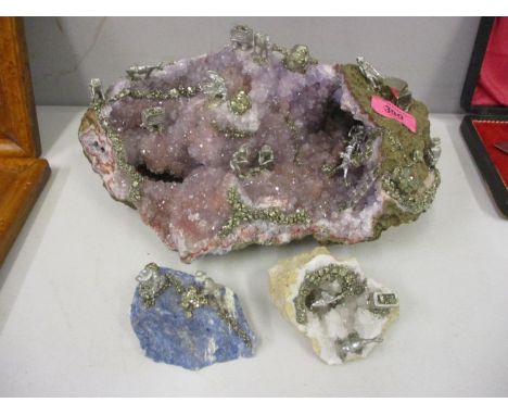 Three rock crystals with applied decoration to include a large amethyst 