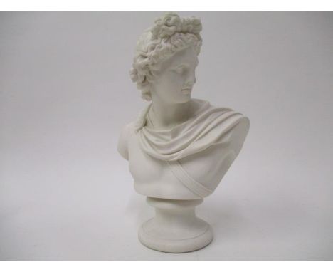 A 19th century Parian ware bust of a classical man wearing a sash, on a sockel, 11"h 
