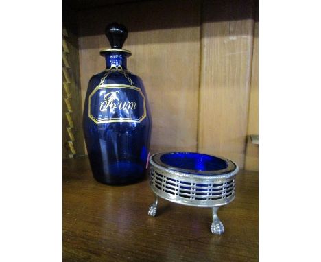 A Georgian style Bristol blue glass rum decanter with gilt decoration and a Georgian silver oval salt with blue glass liner, 