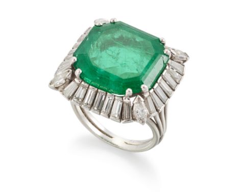 An emerald and diamond ring, of cluster design, the central octagonal step cut emerald measuring approximately 15.8 x 16.3 x 