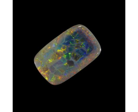 An unmounted cushion shaped dark/semi-black opal, 21 x 13 x 2mm, approximately 5.3 caratsProvenance: The Wasserberg collectio