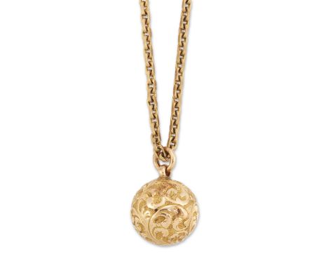 An early 20th century chased globe pendant, circa 1900, suspended on a 9ct gold filed trace link chain, chain with London imp