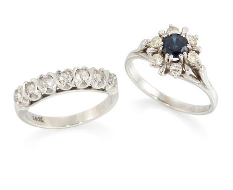 A group of two rings, comprising: an 18ct white gold sapphire and diamond cluster ring, with a round mixed cut sapphire to su