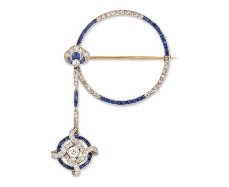 An Art Deco sapphire and diamond brooch, an openwork quartered hoop set with single cut diamonds and calibré cut sapphires, s