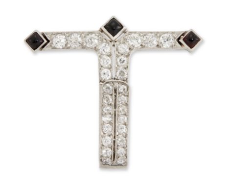 An Art Deco diamond and onyx brooch,&nbsp;of T form, grain set with old brilliant cut diamonds and with buff top onyx accents
