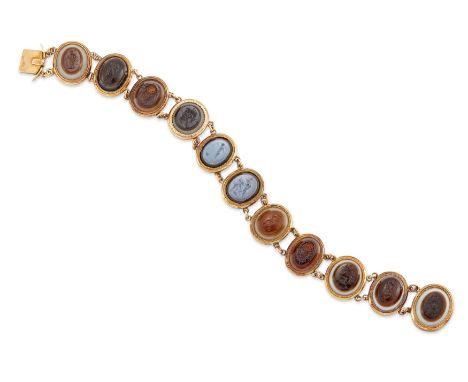 An early 19th century gold mounted bracelet set with glass intaglios, the flexible bracelet composed of eleven glass oval int