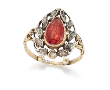 An early 19th century foiled topaz and diamond ring, of heart design, with a pear shaped foiled topaz to pierced surround set