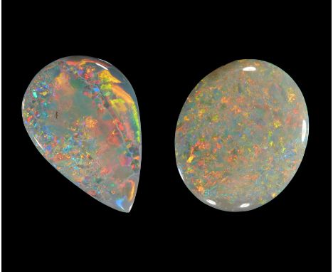 Two unmounted dark/semi-black opals, comprising: one oval opal, 16 x 13 x 4mm, approximately 5.3 carats; and a pear shaped op