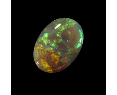 An unmounted oval dark/semi-black opal, 24 x 16 x 4mm, approximately 10.2 caratsProvenance: The Wasserberg collection, by des