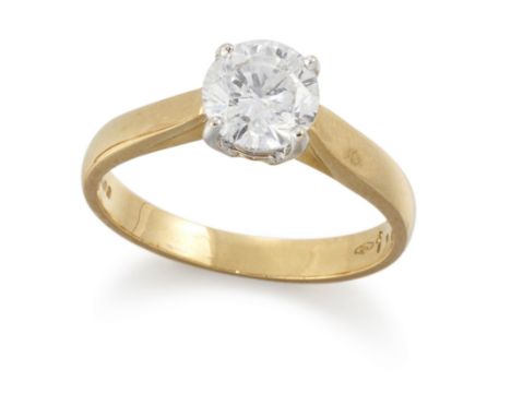 An 18ct gold diamond single stone ring, with a brilliant cut diamond claw set to a plain hoop, Sheffield hallmarks, ring size