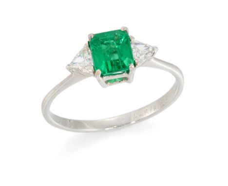 H Stern. An emerald and diamond three stone ring, an emerald cut emerald with a stated weight of 0.74 carats, with a triangul