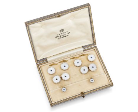 Asprey & Co. An Art Deco gold, sapphire and mother of pearl dress set, comprising: a pair of cufflinks, designed as two colou