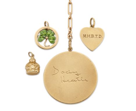 A collection of charms and pendants, comprising: a hollow Buddha charm, stamped 14kt; an enamel four leaf clover charm; a hea