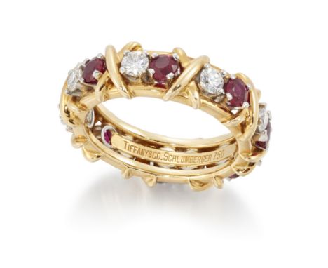 Tiffany & Co, Schlumberger. A diamond and ruby eternity ring, set with brilliant cut diamonds and circular cut rubies, stampe