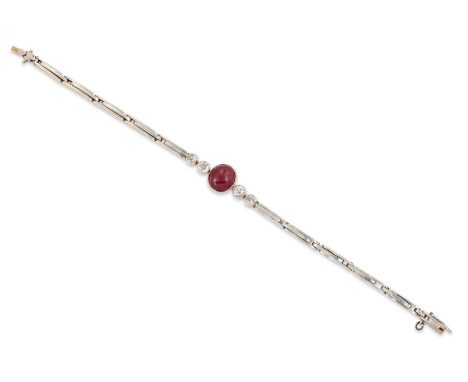An early 20th century 18ct gold ruby and diamond bracelet, an oval cabochon ruby with a pair of old brilliant cut diamonds at
