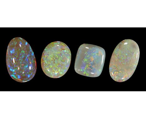 Four unmounted crazed opals,&nbsp;comprising: an oval opal, 24 x 14 x 6mm, approximately 12.4 carats; a cushion shaped opal, 