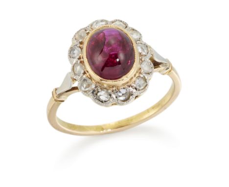 A ruby and diamond cluster ring, with an oval cabochon ruby to surround of rose cut diamonds, French assay mark, ring size L½