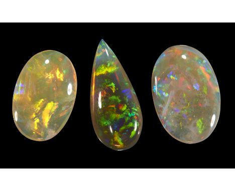 Three unmounted crystal opals, comprising: one pear shaped opal, 22 x 10 x 5mm, approximately 6.0 carats; and two oval opals,