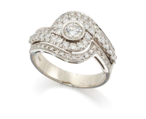 An Italian diamond crossover ring, a brilliant cut diamond to three row brilliant cut diamond set crossover shoulders, and a 