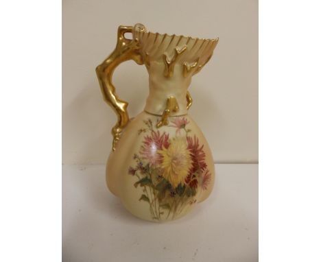 A Royal Worcester floral painted jug with gilt branchiform handle