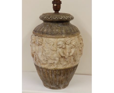 A relief moulded earthenware lamp base