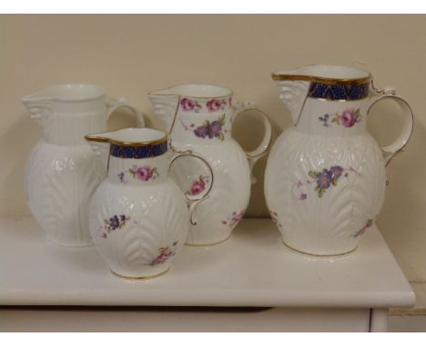 Four modern Coalport jugs in Caughley mask pattern
