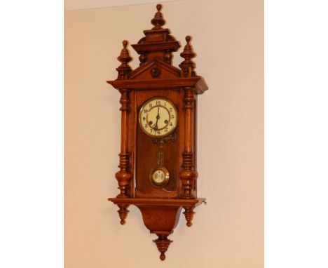 A 19thC German walnut cased striking wall clock, 36” high overall