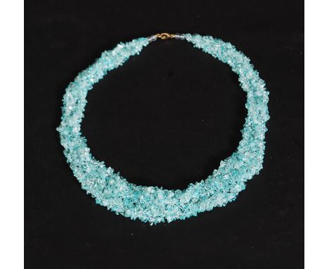 A 9ct gold and festooned beaded aquamarine coloured stone vintage necklace choker collar. The multiple stringed stones set to