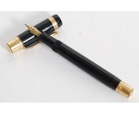 A vintage Kaweco black and rococo chase gold trim fountain pen with a 14ct gold nib.

FREE UK POSTAGE ON ALL LOTS INCLUDING C