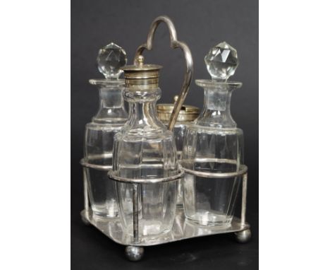 A vintage silver plate and cut glass cruet set  on stand. Stamped to underside for Harrison Fisher - 1900 - 1925.