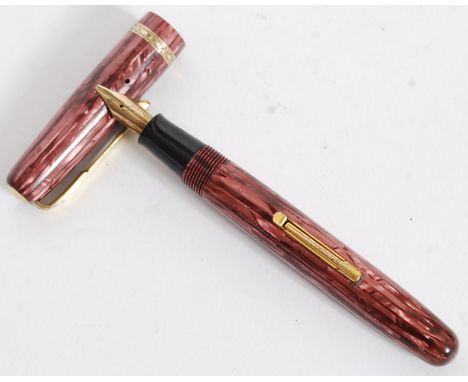A Vintage Watermans 512v fountain pen In A Purple lustre Straight Pearl Pattern - lever fill with gold trim. Watermans 14ct n