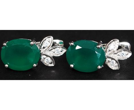 A pair of silver and jade ear stud - earrings. Total weight 6.1g.

FREE UK POSTAGE ON ALL LOTS INCLUDING COMBINED PURCHASES (