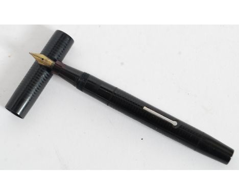 A vintage Mable Todd & Co Ltd Blackbird Self Filling Pen -  fountain pen with a 14ct nib in black case and cap with ribbed de