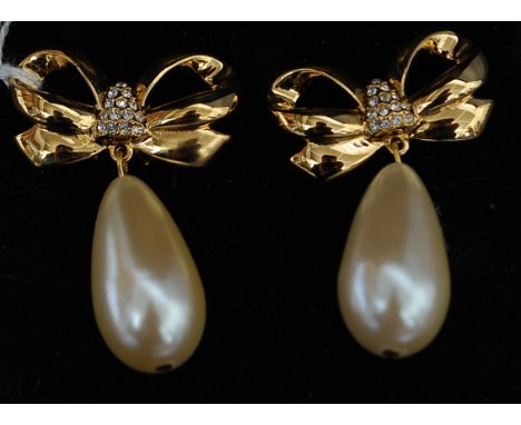 A pair of vintage yellow metal Elizabeth Taylor ' white diamonds ' drop earrings of ribbon form with pave set diamonte centre