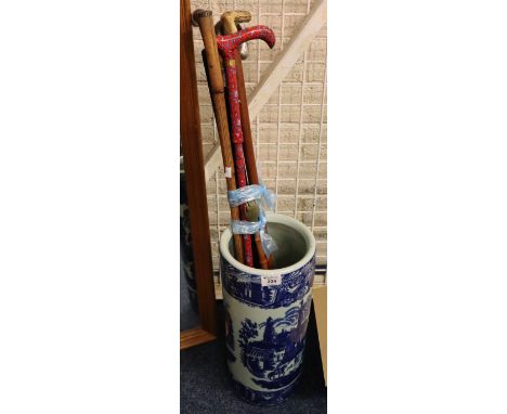 Bundle of assorted walking sticks, back scratcher etc in an oriental style ceramic stick stand. (B.P. 24% incl. VAT)