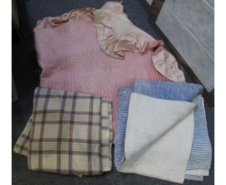 A vintage check woollen blanket, together with two vintage quilted bedspreads, one striped and one pink with leaf and geometr