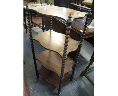 Victorian rosewood four tier whatnot on bobbin turned supports. (B.P. 24% incl. VAT)