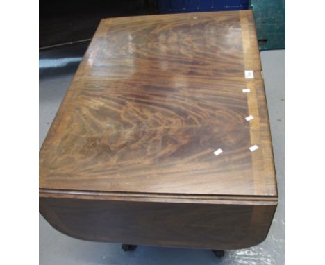 19th Century mahogany sofa table on a quatreform base, paw feet and casters. (B.P. 24% incl. VAT)