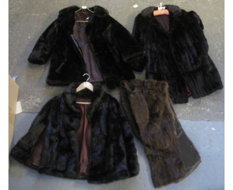 Collection of vintage clothing to include; a dark brown knee length fur coat, a fur stole, a faux fur cape and a faux fur jac